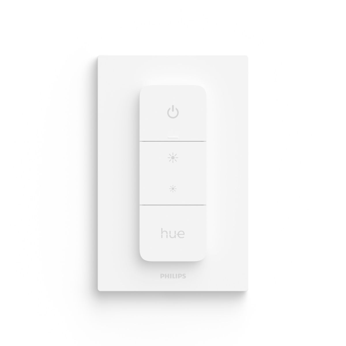 Front face photo of the white Philips remote on a white wall. It's fixed onto its wall holder and the remote is shaped as a simple portrait-oriented rectangle with only 4 buttons and soft grey indicators