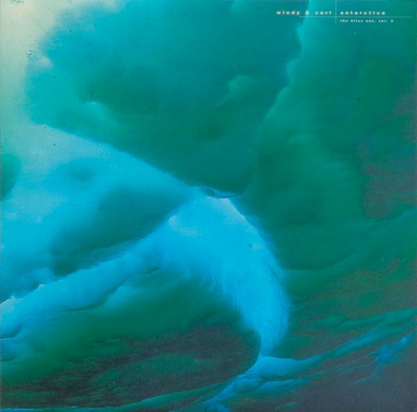 Greenish and blueish photography of what appears to be an underwater view of floating ice slabs. Overlaid, a subtle typography with the band and the album names