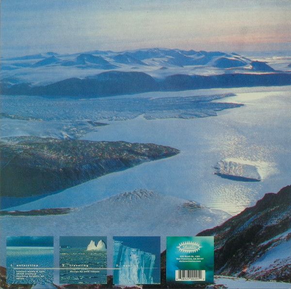 Presumably the back art with a collage of different landscapes of Antarctica (probably) depicting ice seas and ice mountains