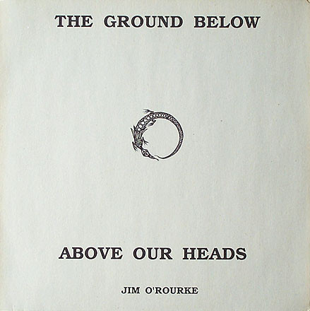 As described before. Background is paper white and in black is the serif font title broken in two, with half above the symbol and the rest below, with Jim's name at the very bottom